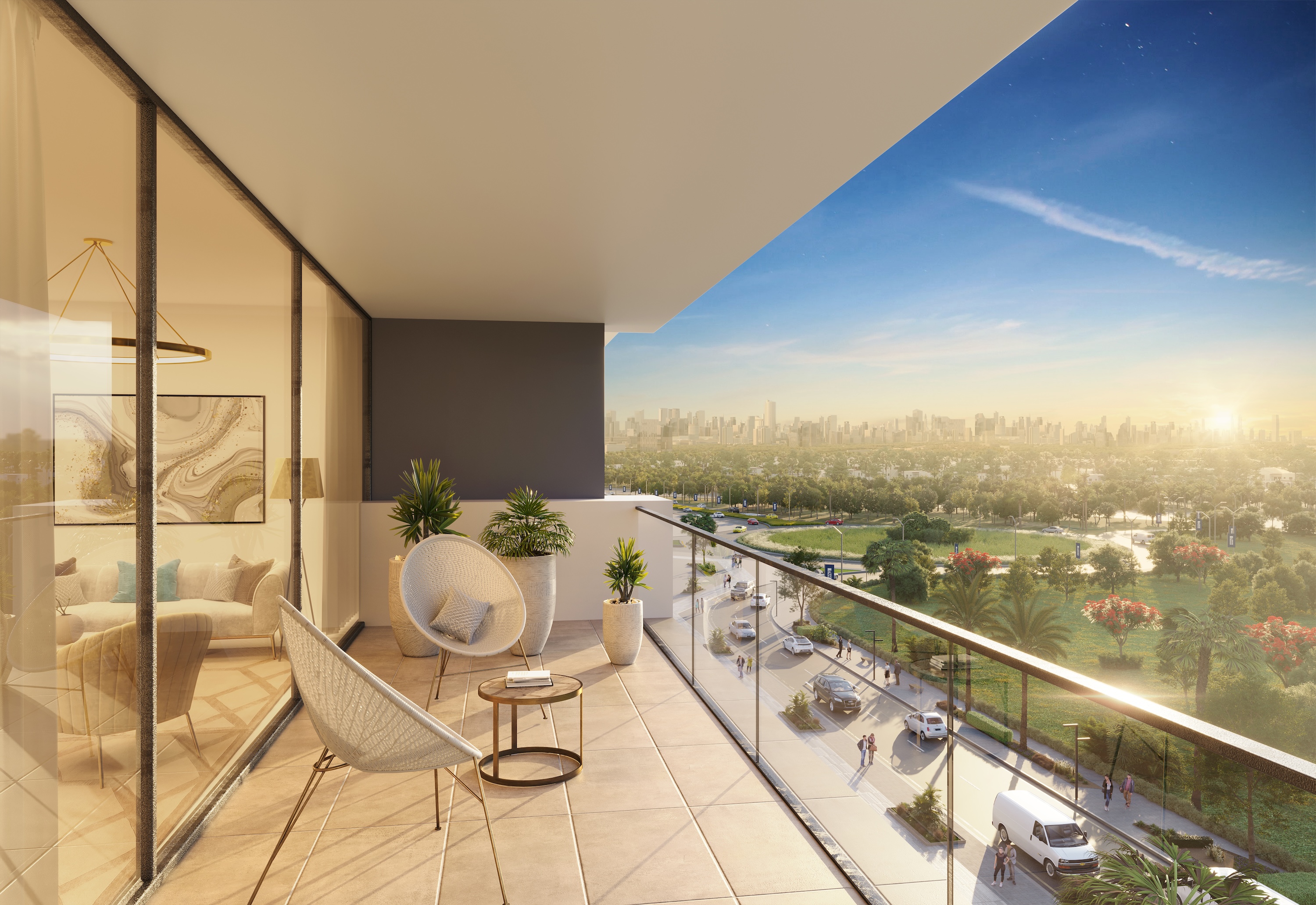 Balcony view from Azizi Riviera 69 overlooking parks and Dubai city skyline at golden hour
